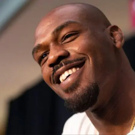 Jon Jones Soaks It In as ‘F—k Tom Aspinall’ Chants Break Out During DBX1 Weigh-Ins